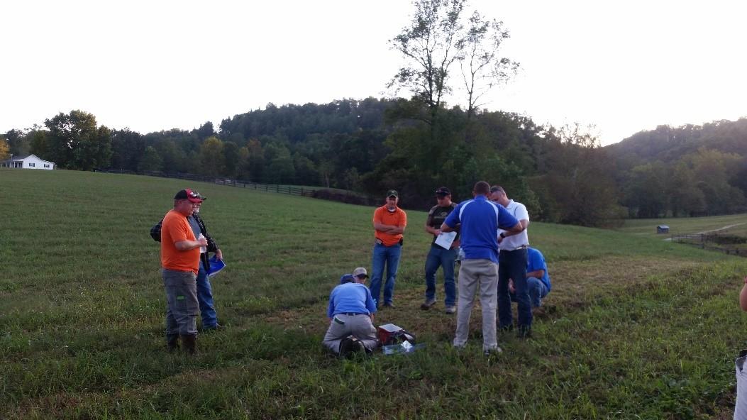 Dr. Ray Smith discussing frost seeding with producers.